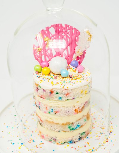 A mint colored macarons tiered cake