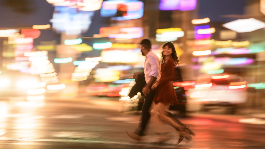 Man and woman crossing the Las Vegas Strip