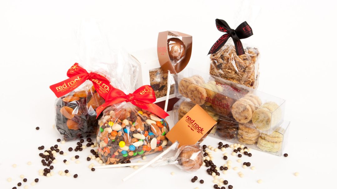 a photo of chocolates and nuts in gift bags